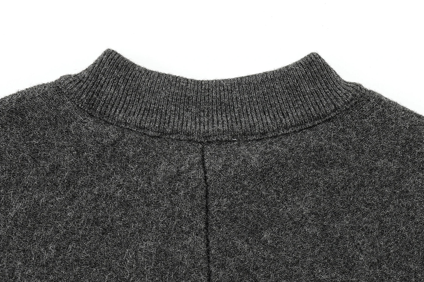 Close-up of a dark gray cape with a ribbed neckline on a white background