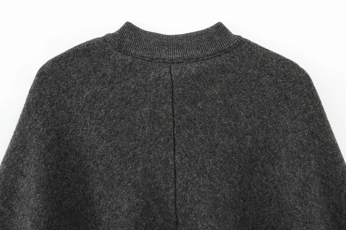 Dark gray cape with a close-up of the collar on a white background