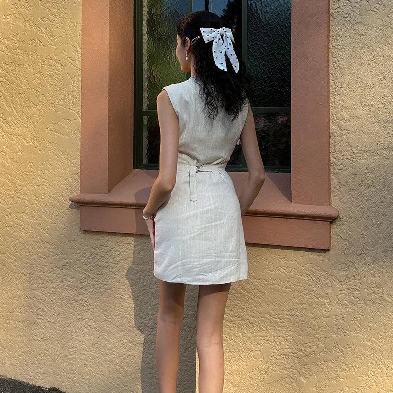 A stylish sleeveless mini dress crafted from airy linen, designed for comfort and elegance on relaxed summer