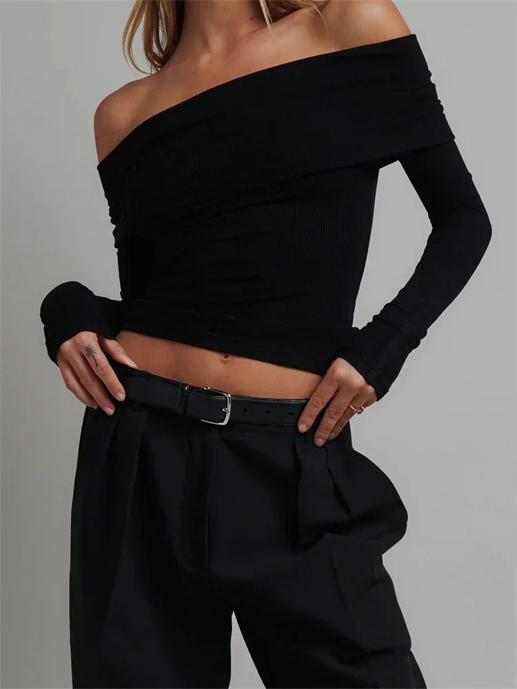 Close-up of the Off-Shoulder Long Sleeve Knitted Tee, illustrating the softness and stretch.