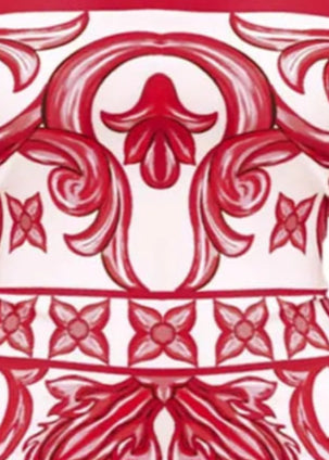 Red and white patterned swimsuit on a white background