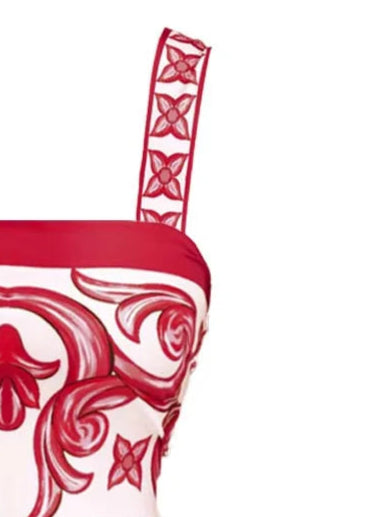 Red and white patterned swimsuit on a white background
