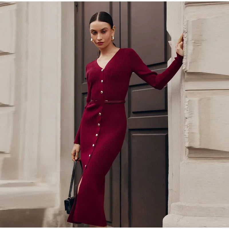 Side view of Burgundy V-neck knitted long dress worn by model, showing its flattering fit.