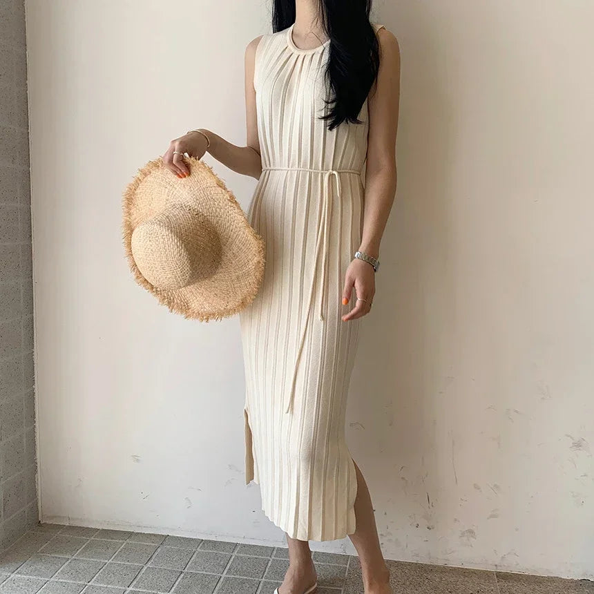 Relaxed beige knitted tank dress with a side split, designed for summer comfort.