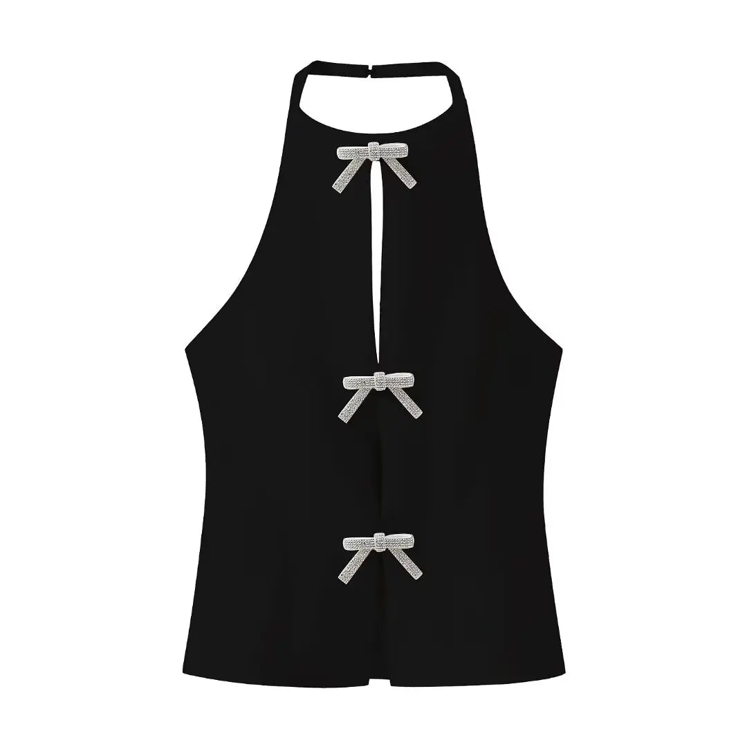 Black halter neck top with a diamond bow for a chic and sophisticated look, perfect for elegant evening events.