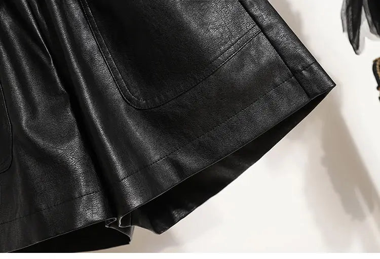 Close-up of the hem of the Black High-Waist Leather Shorts, highlighting the quality finishing.