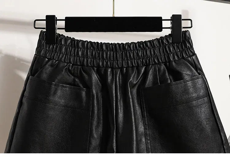 Zoom on the waist of the Black High-Waist Leather Shorts, emphasizing the tailored fit and high-waisted design