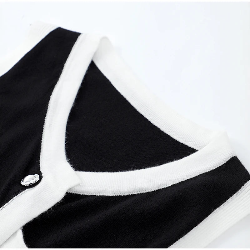 black knit ribbed mini dress, details highlighting its sleek design.