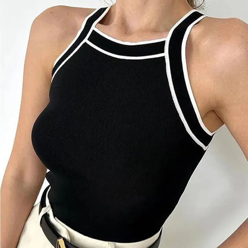 Model wearing the black knitted crop tank, viewed from an upper angle, showcasing its stylish fit