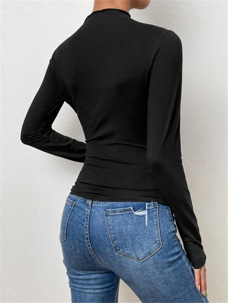 Black old-money style t-shirt with elegant diagonal pleats, ideal for fall fashion.