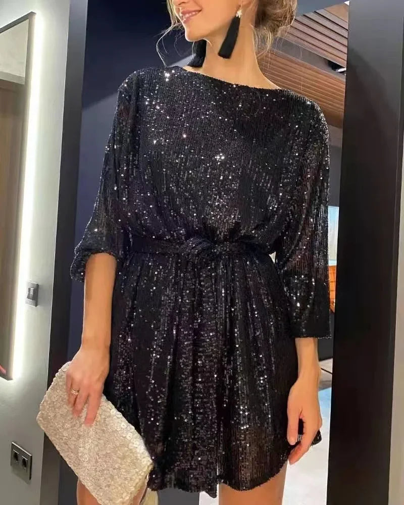 Elegant black sparkling beaded mini dress with three-quarter sleeves, ideal for cocktail parties