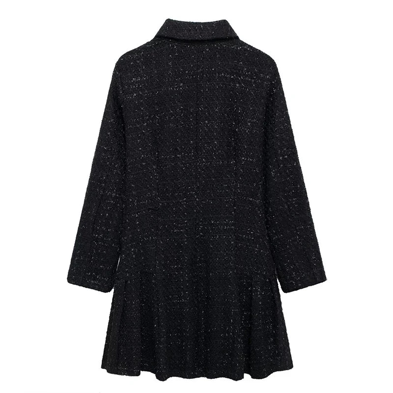 Black vintage-inspired tweed dress featuring a loose fit and charming bow-shaped button closure.