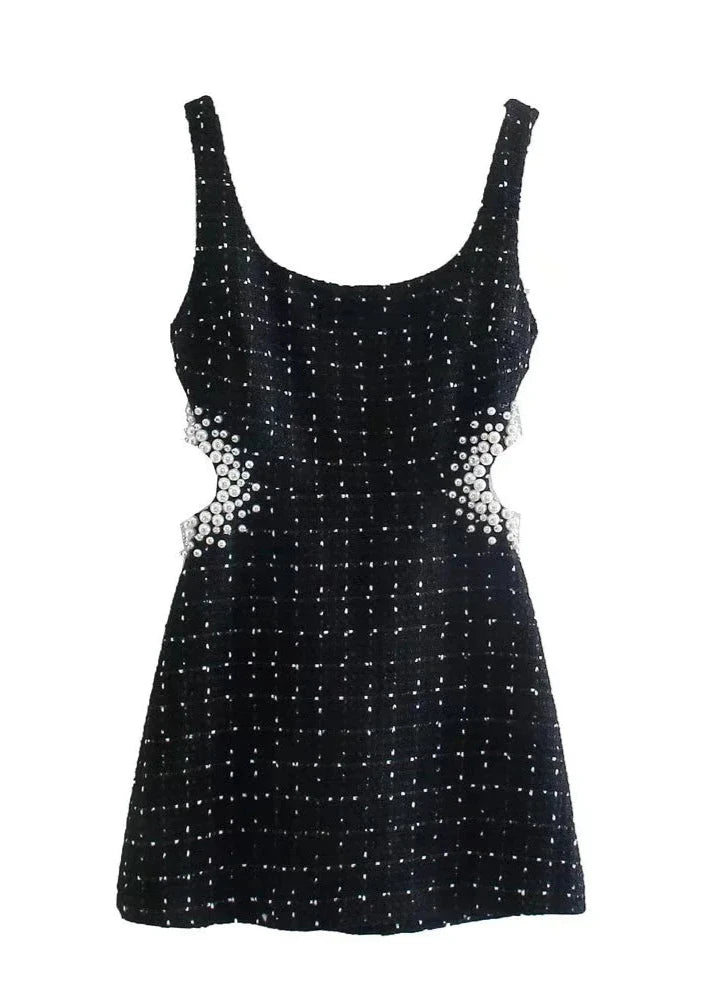 Black tweed mini dress with pearl embellishments, perfect for chic evening wear.