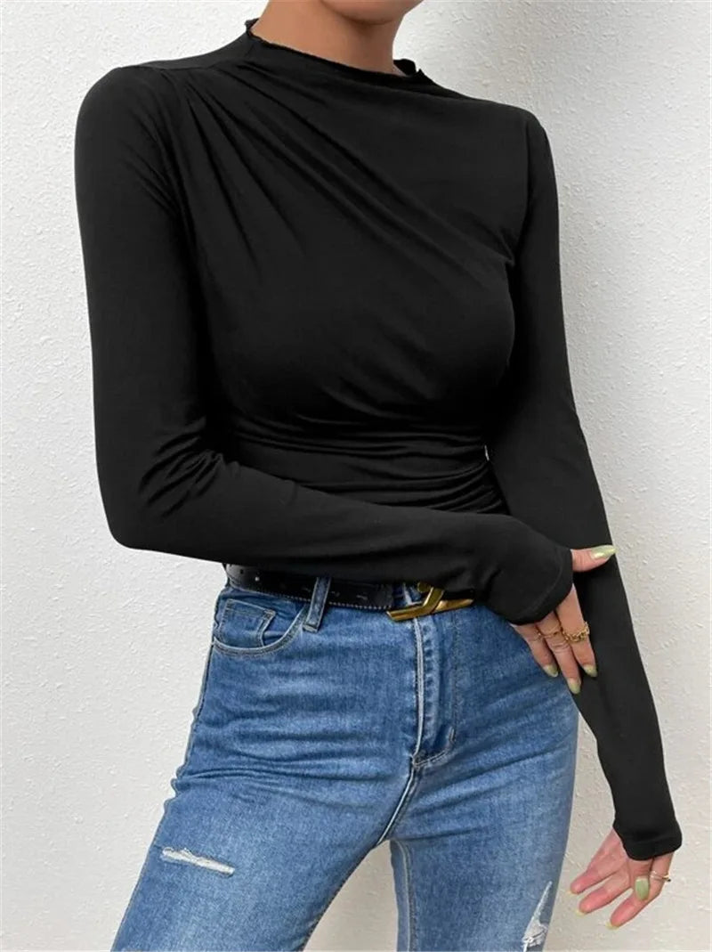 Black vintage pleated t-shirt showcasing modern elegance and fall sophistication.