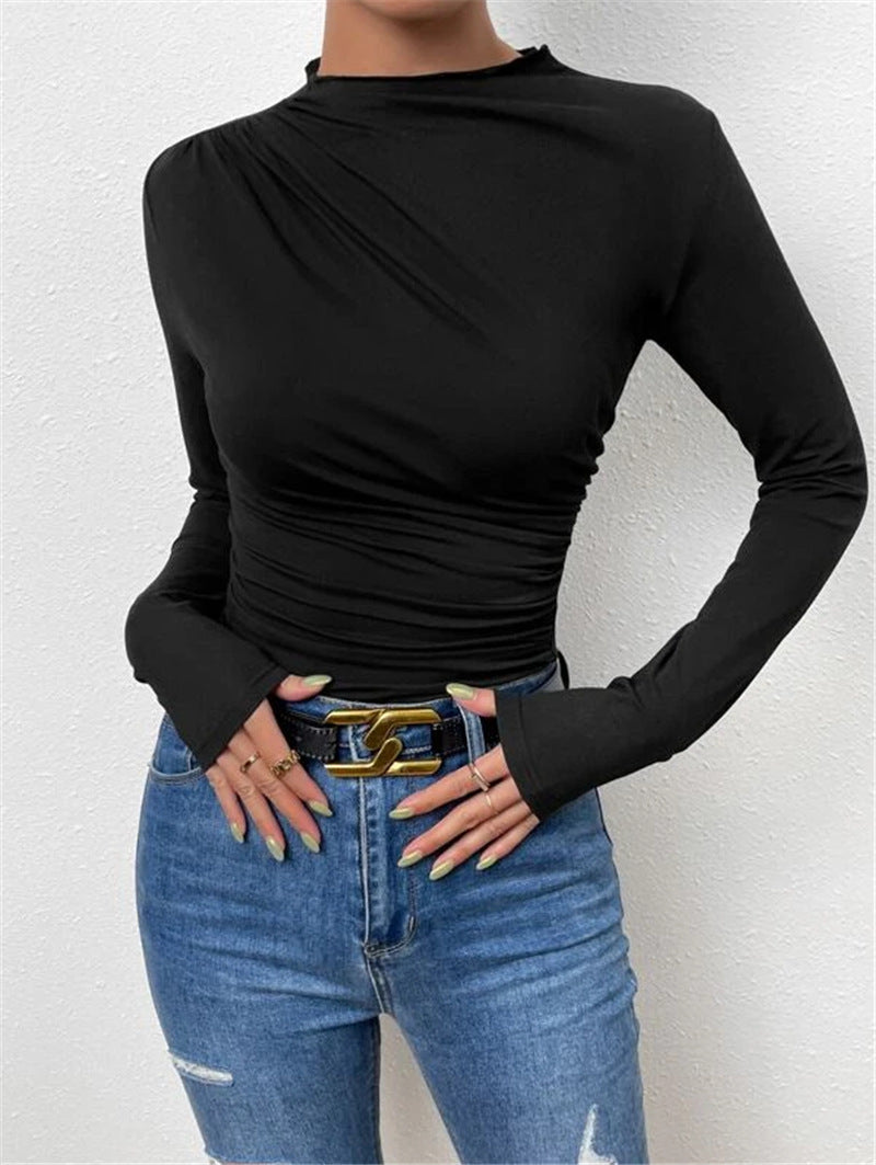 Black vintage pleated t-shirt showcasing modern elegance and fall sophistication.