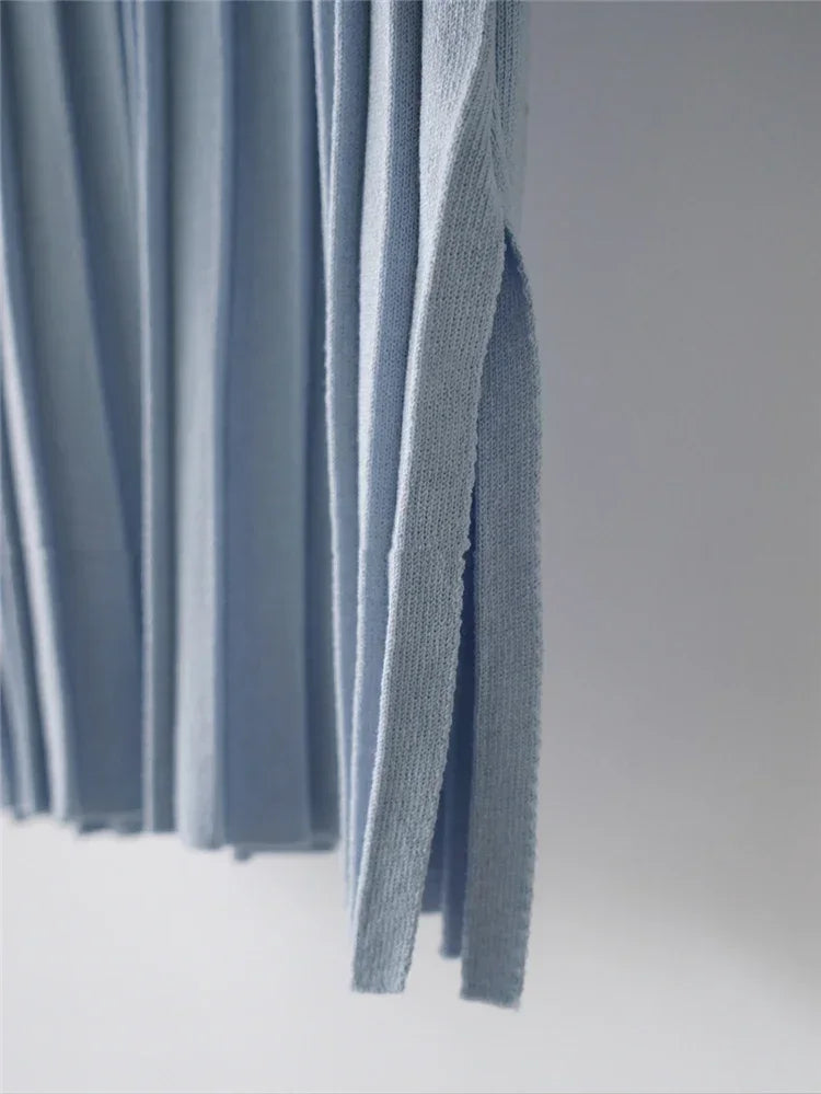 Relaxed blue knitted tank dress with a modern silhouette, perfect for warm-weather days.