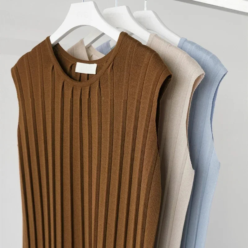 Knitted tank dresses in brown, beige, and blue, featuring a mid-calf length and casual, loose fits.