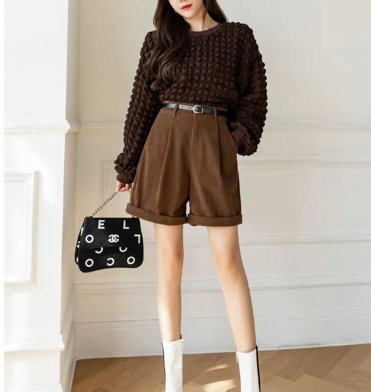 Model standing in Brown Corduroy High-Waist Shorts, showcasing a casual and chic outfit perfect for any occasion.