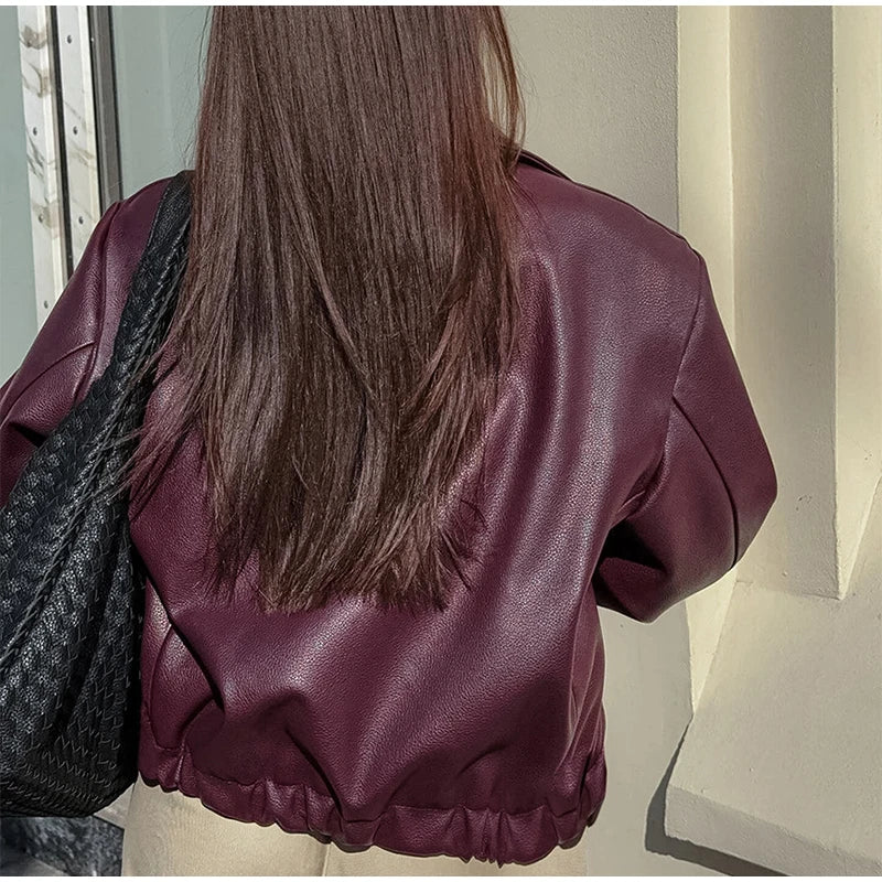 Back view of the Burgundy Faux Leather Jacket, highlighting the design and fit from behind.