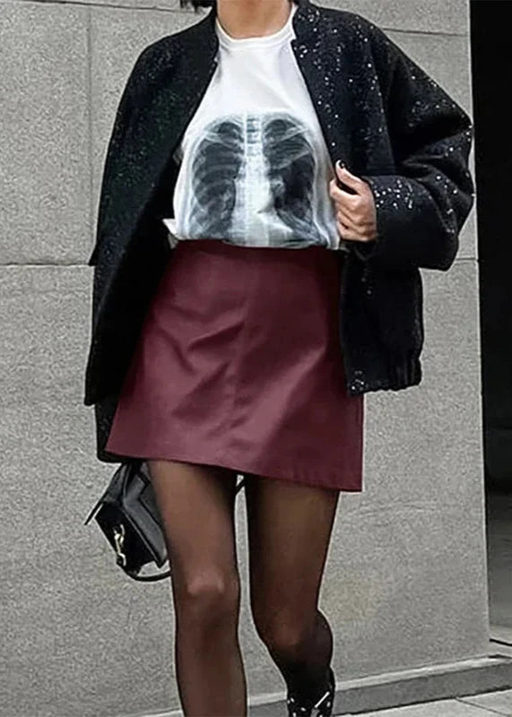 Burgundy Leather Mini Skirt styled on model, showcasing a chic and trendy look.