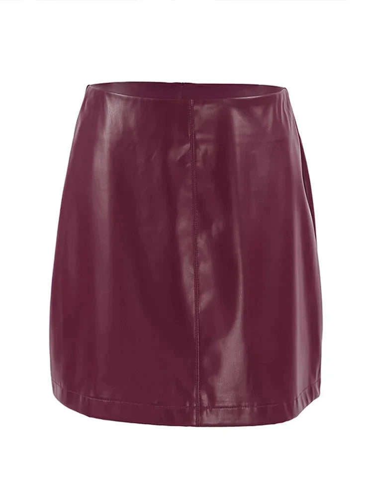 Burgundy Leather Mini Skirt displayed on a flat surface, showcasing its stylish design.