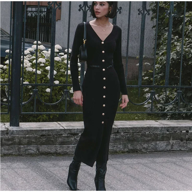 Model standing in Black V-neck knitted long dress, showing off the chic, form-fitting design.