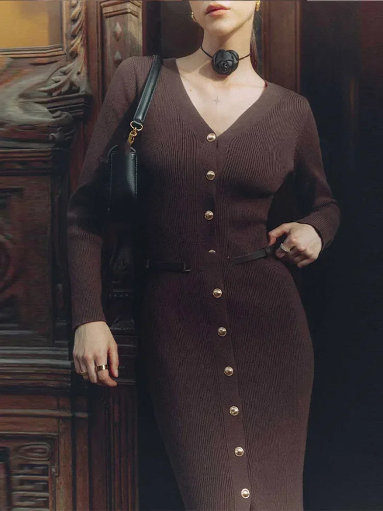 Coffee-colored V-neck knitted long dress worn by model, creating a warm and stylish appearance.