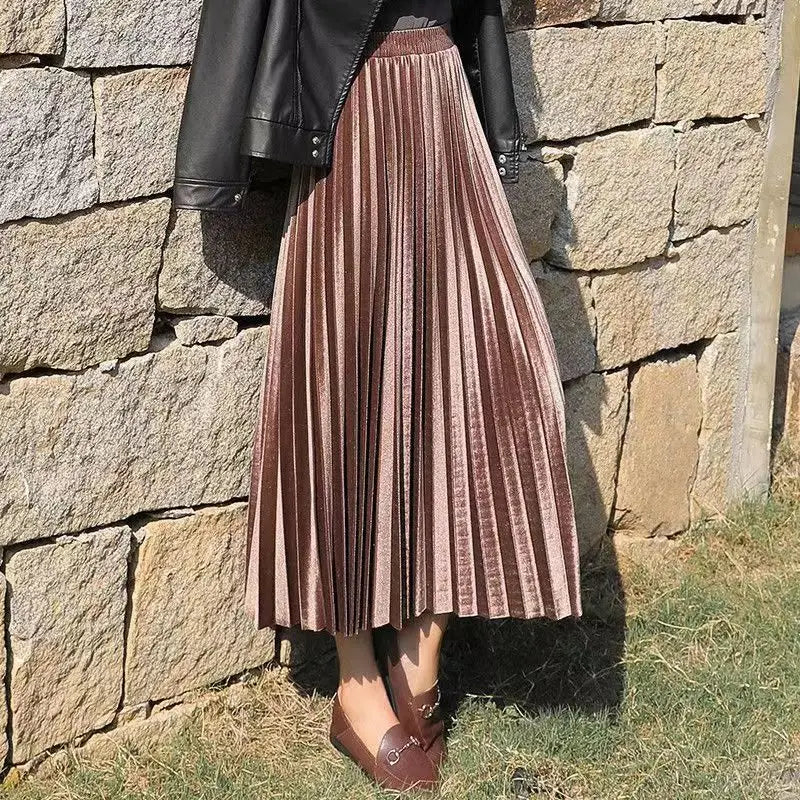 Soft champagne pleated velvet midi skirt with graceful pleats and a timeless A-line design for refined autumn style.