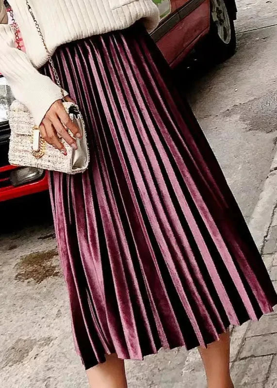 Elegant claret pleated velvet midi skirt with a high waist and luxurious texture, perfect for festive occasions.