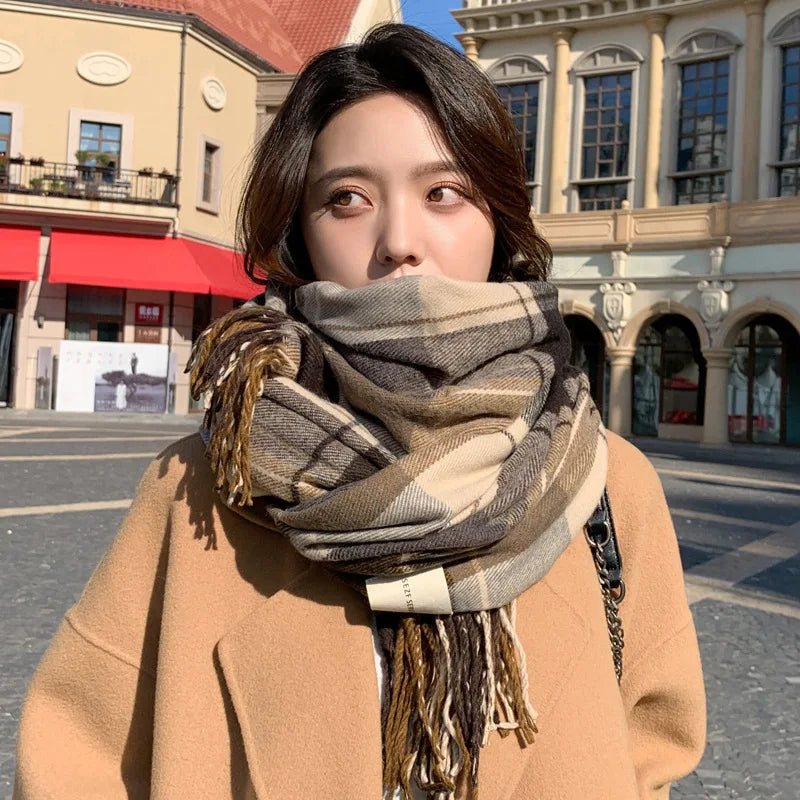 Model wearing coffee-colored plaid winter scarf, adding a cozy, classic look to winter outfit