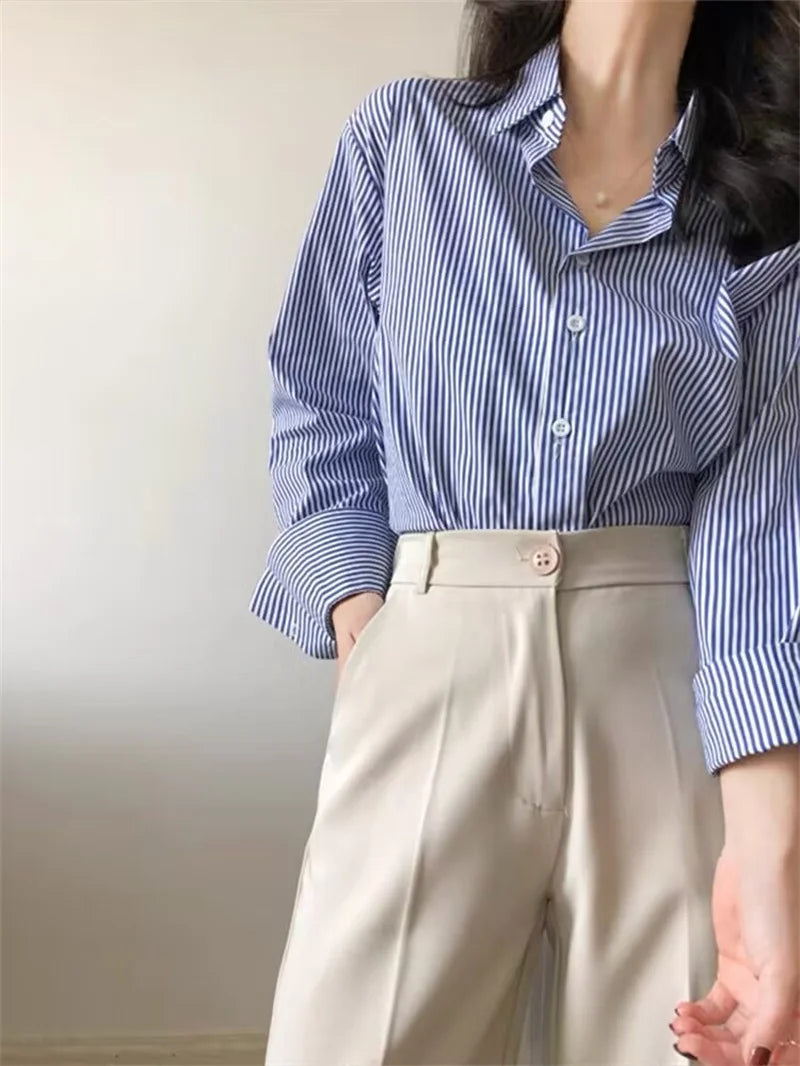 Classic striped blouse styled in business casual, combining elegance and comfort