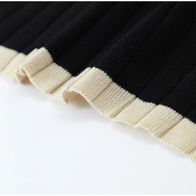 Close-up shot of the beige contrast details on the Color Blocked Knitted Mini Dress, emphasizing the stylish color contrast