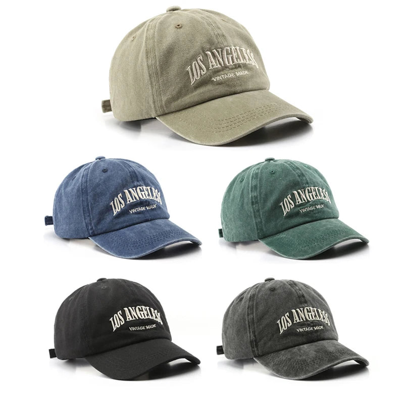 All Cotton Baseball Cap in black, green, blue, grey, and khaki displayed together.