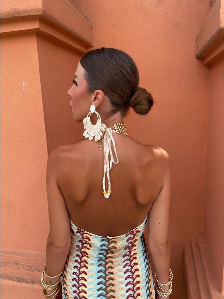 Timeless elegance in a deep V-neck dress, perfect for summer allure