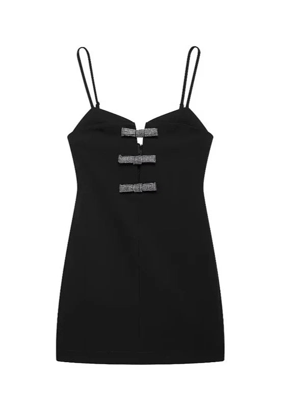 Front view of black V-neck mini dress with sparkling diamond bow details, chic and elegant.
