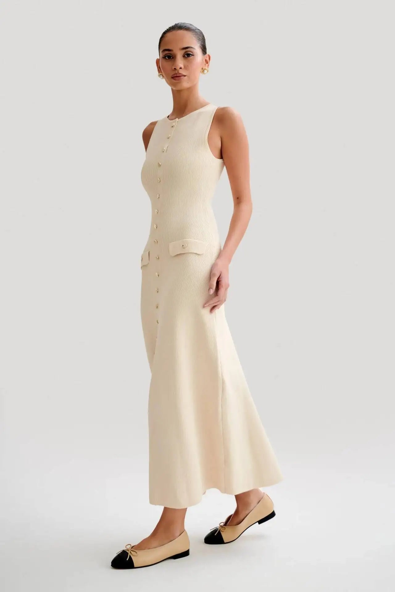 Chic beige knitted dress, embodying classic elegance and sophistication for formal and evening wear