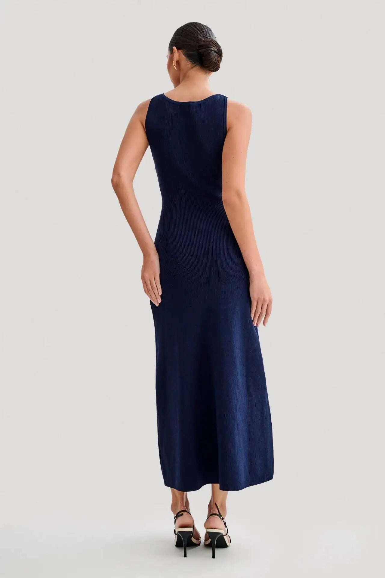 Back view of the elegant blue knitted dress, perfect for high-end, timeless style
