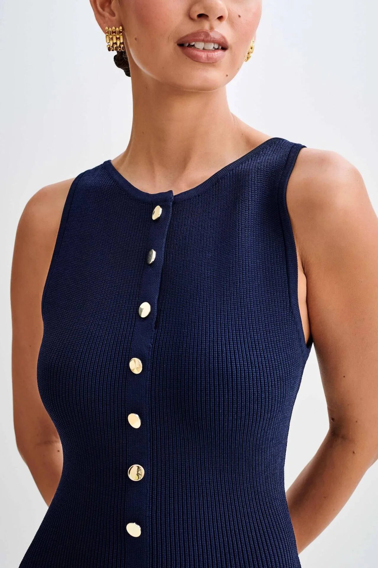 Close-up of the elegant blue knitted dress with refined shoulder detailing for an old money vibe