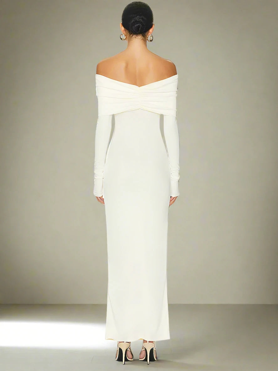 Chic and sophisticated white off-shoulder maxi dress for holiday occasions.