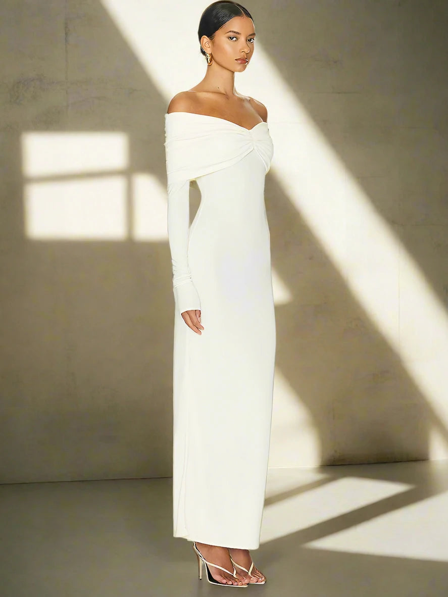 Celebrate New Year's Eve in a stunning white off-shoulder maxi dress.