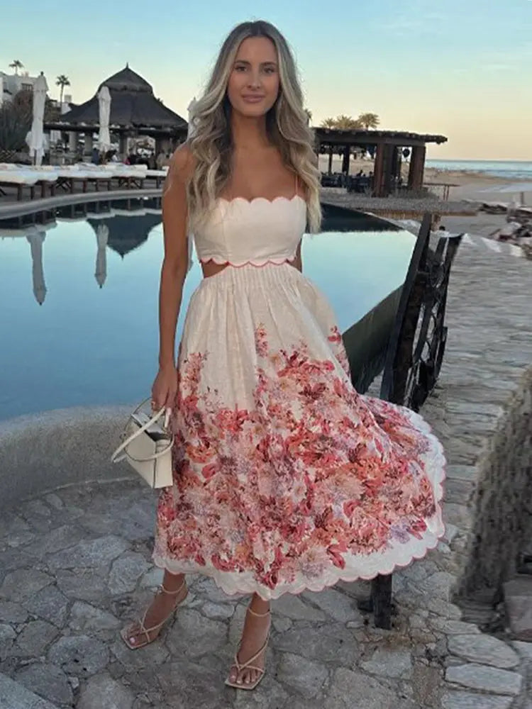 Elegant red floral midi dress featuring a flattering lace-up back, ideal for outdoor events and garden parties