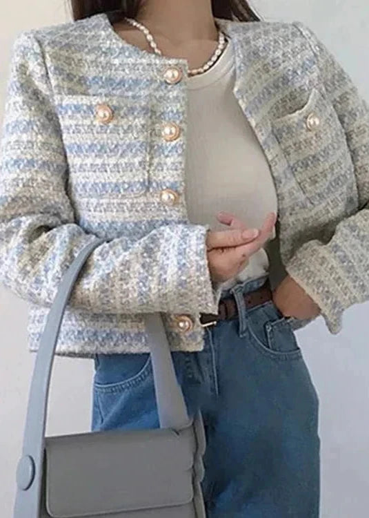 Elegant tweed jacket in a chic fusion of white, blue, and grey, ideal for a sophisticated office or casual luxury look.