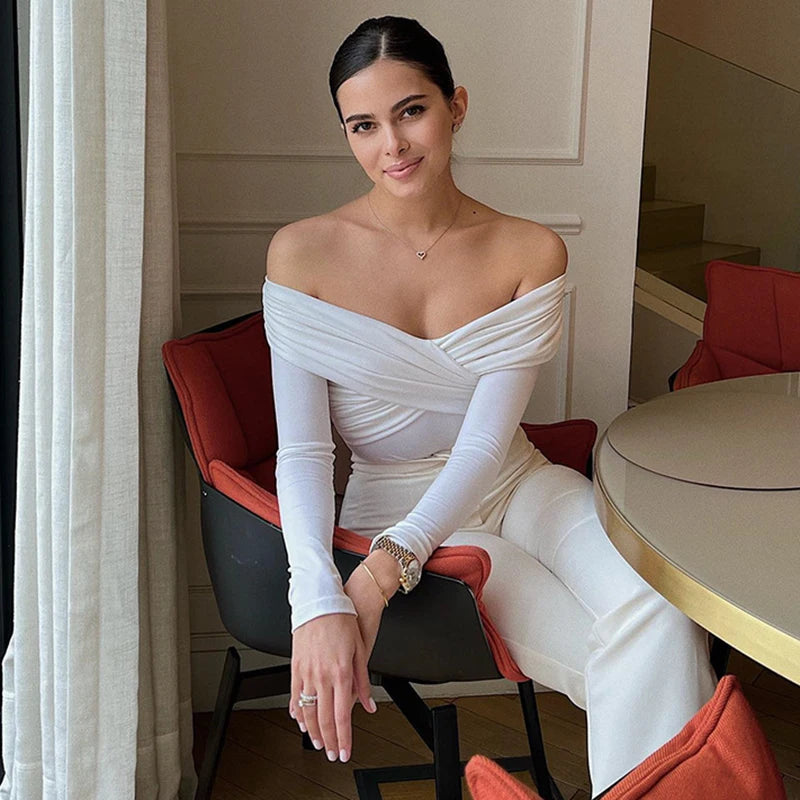 Elegant white off-shoulder bodysuit with corset detail, ideal for glamorous events.