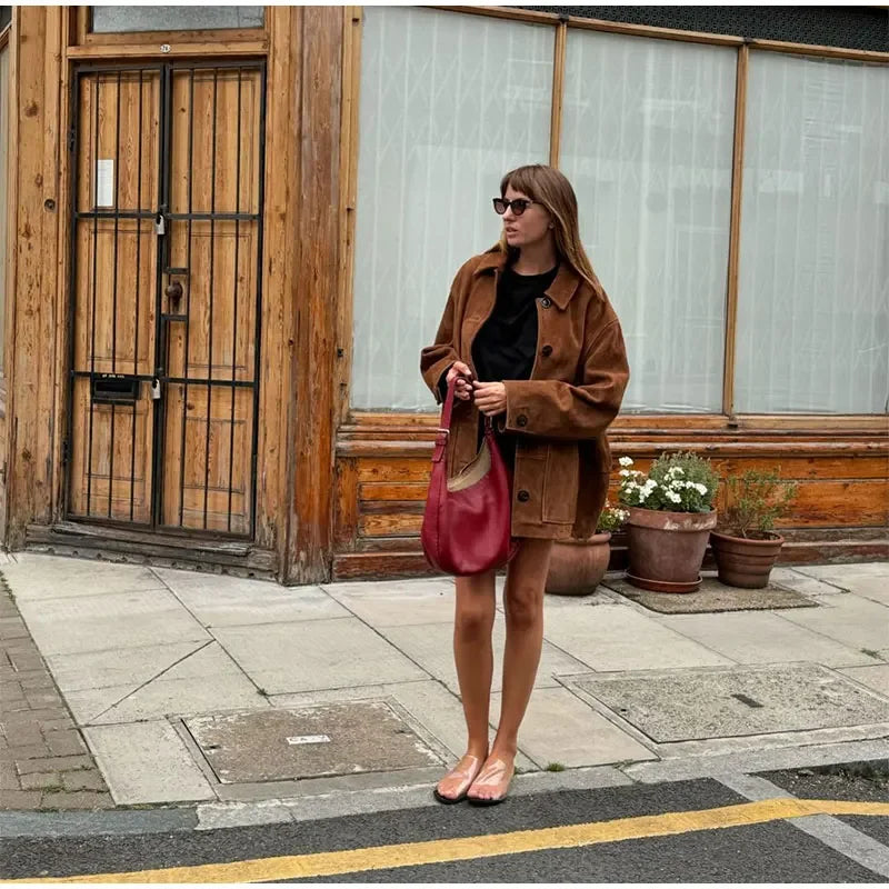 A classic brown suede jacket styled for fall, blending timeless elegance with high-street appeal