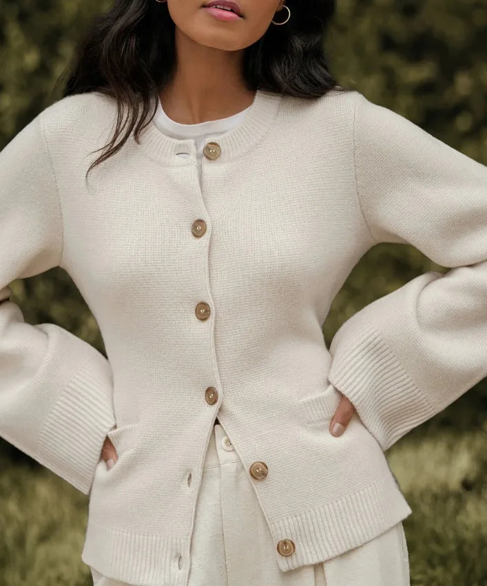 Beige cardigan featuring practical front pockets and a single-breasted closure for chic, functional fashion