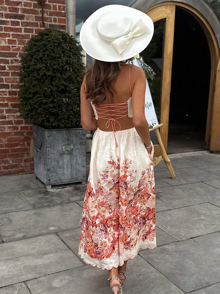 Red floral printed backless midi dress with lace-up details, perfect for a romantic summer look