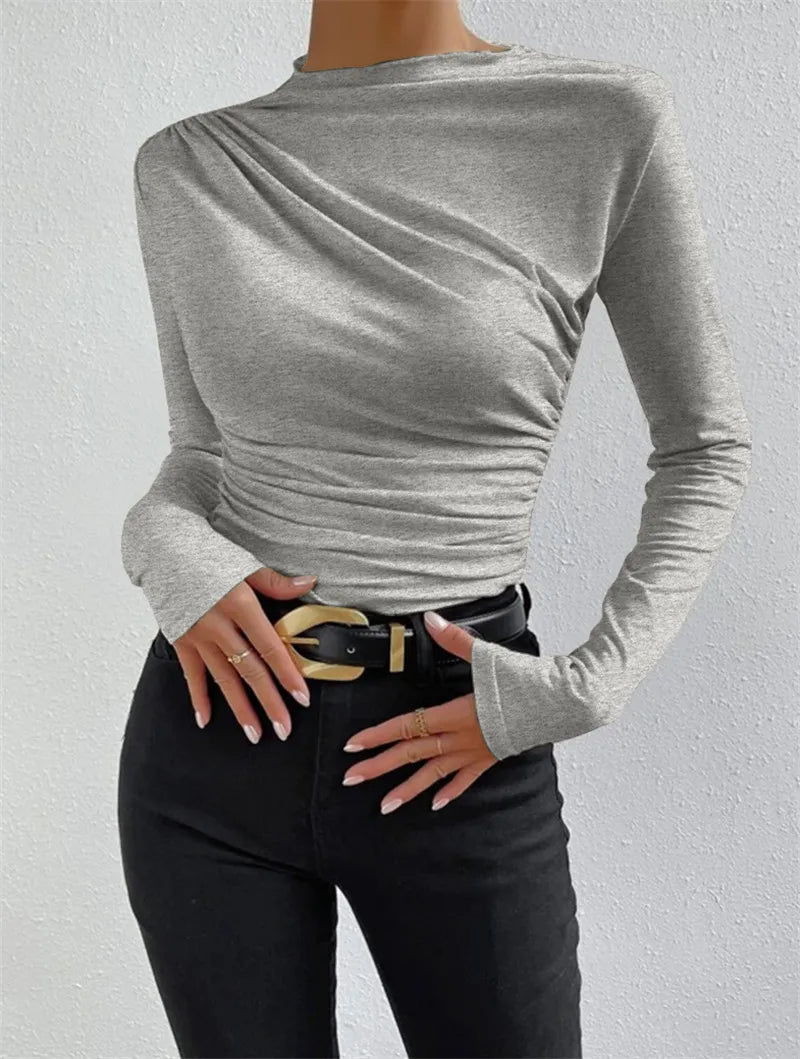 Gray pleated t-shirt, blending chic elegance with seasonal autumn/winter style.