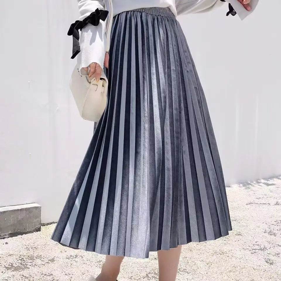 Classic gray pleated velvet midi skirt with a flattering A-line shape, suitable for casual or party wear.