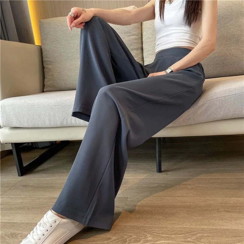 Minimalist gray wide-leg pants with a high waist, ideal for chic fall outfits.