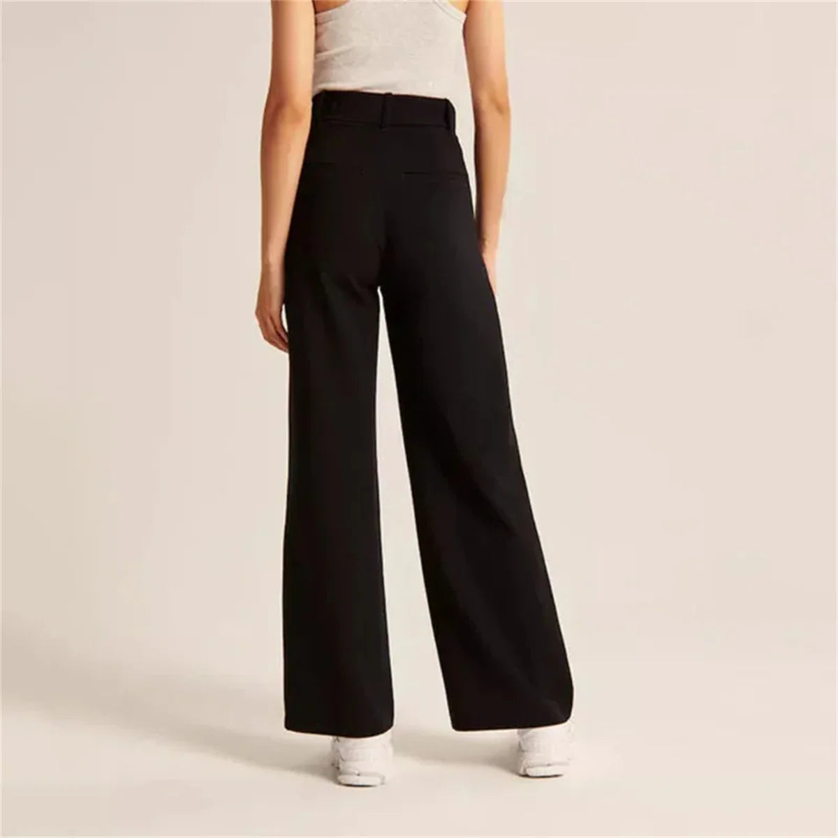 Back view of Black High-Waisted Palazzo Pants showing stretch waist and pockets for versatile workwear.